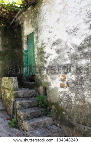 Picture of an old door and old stairs