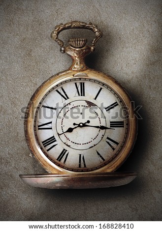 beautiful vintage hand clock on a textured background