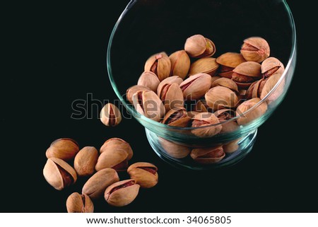 salted pistachios nut on a black background