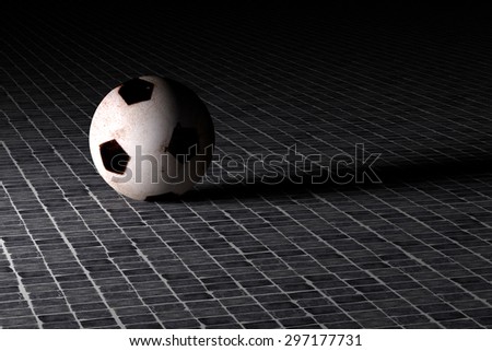3d rendering of a  soccer ball on an old tiles floor