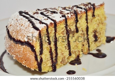 Piece of Corn Cake/ a piece of cake made of corn flour under chocolate icing
