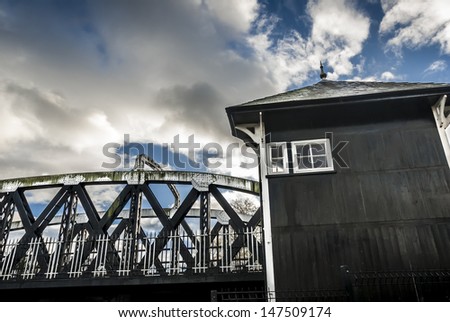 19th Century Iron swing bridge and wooden house  in Northwich, Cheshire.