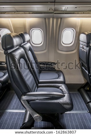 Leather seating inside cabin of a luxury jet Concorde.