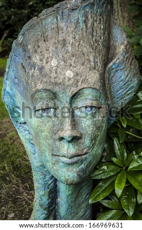 Plant Head woman sculpture in public gardens.