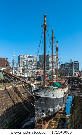 A sailing ship in dry dock at Liverpool Albert Dock.