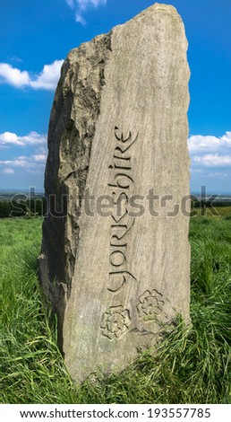 A standing stone sign with Yorkshire carved into it.