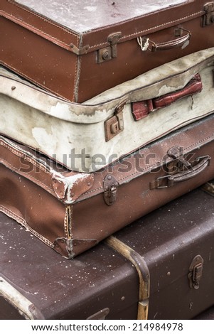 Vintage travel cases piled together.
