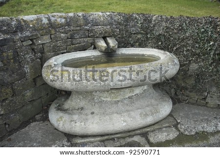 Stone bath with water spout