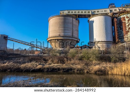 Industrial chemical plant alongside a river.