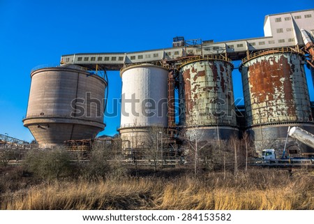 Industrial chemical plant with large tanks.