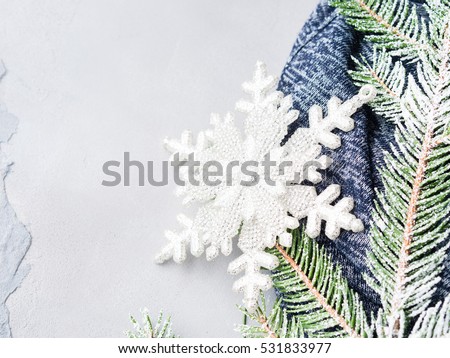 Winter christmas background with fir tree branches. Snow and snow flake decoration. New year greeting card