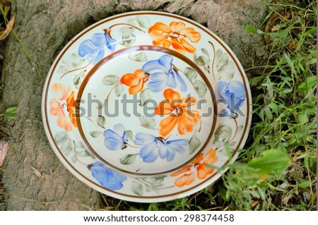 Unique and handmade clay painted plates, 50 years old, from creative people