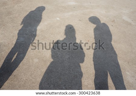 Abstract, Shadow women and men on concrete floor.