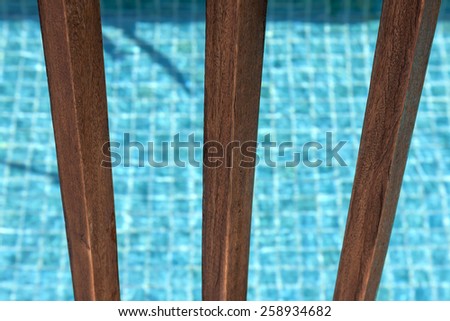 Swimming pool wooden fence closeup