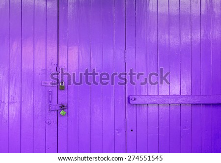 Wooden purple door with lock