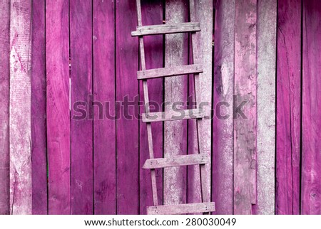 Pink retro tone Hardwood handmade ladder with old wood wall background