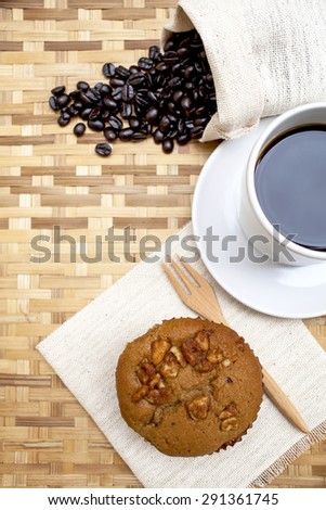 Coffee with Coffee muffin on bamboo tray vertical style