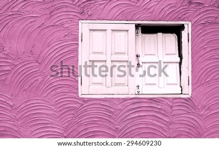 Vintage pink tone cement wall texture with damage white wooden window
