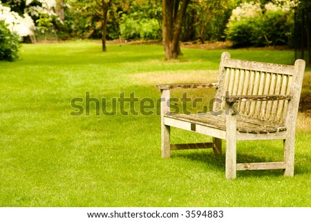 Sit down and relax! Garden bench in a tranquil garden