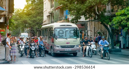HANOI, VIETNAM CIRCA AUGUST 2014: Busy traffic in an asian street, people riding motorcycles, circa august 2014 Hanoi. There are approximately four million motorbikes on the streets of Hanoi.