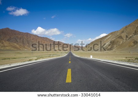 road through mountains in tibet, china