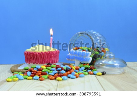 Birthday cake and party decorated with candle on blue background ,vintage tone