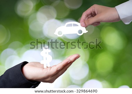 business hand with money and car , business idea and financial concept
