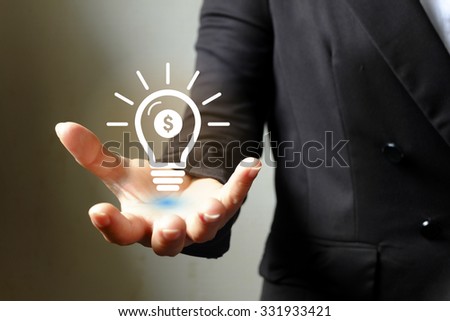 light bulb money on hand business woman , Business idea concept