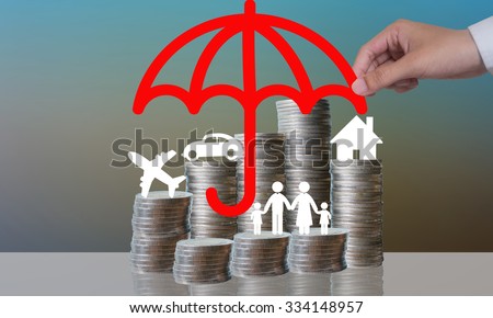 Coin stacks with travel , family , home and car with the protect umbrella on dark background , business idea and insurance concept