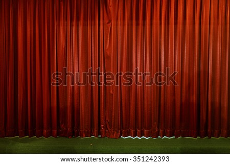 small stage , curtain or drapes red background