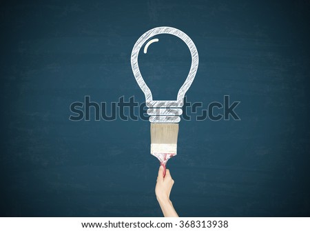 Light bulbs with hand paint on blue chalk board , business concept , business idea