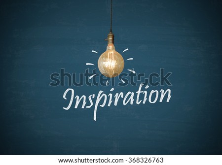 Light bulbs with INSPIRATION text on blue chalk board , business concept , business idea