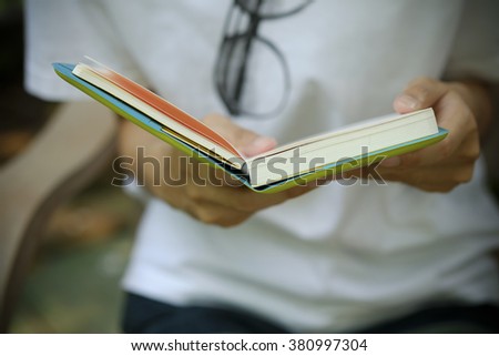 woman in white shirt holding book to read ,Business concept. Business idea