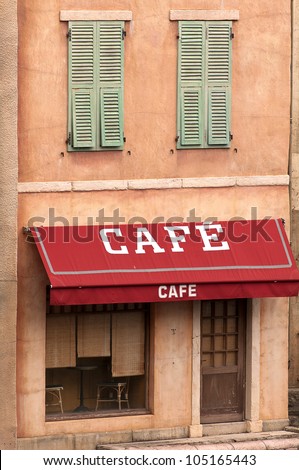 Image of a cafe sign and awning at an old rural french house. Taken in Paris, France