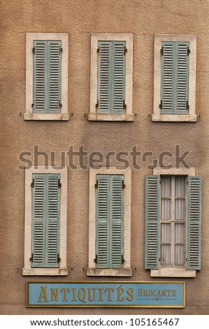 Image of a rural french house with windows and shutters. Taken in Paris, France