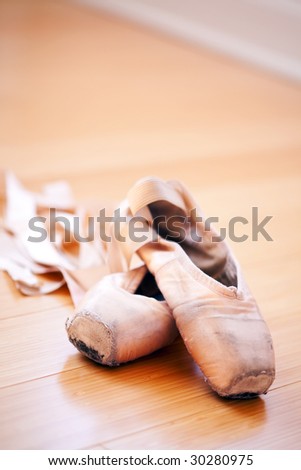 ballet slippers in a well-worn condition