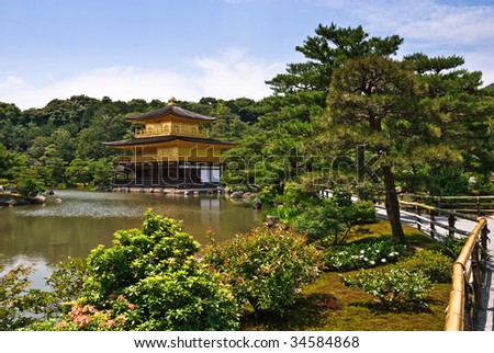 Kinkaku-ji temple, in Kyoto, Japan. The top two stories of the pavilion are covered with pure gold leaf.