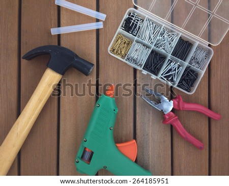 claw, hammer, glue gun and pliers