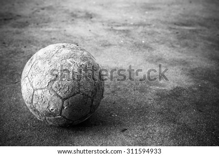 Old soccer ball the cement floor, Vintage style
