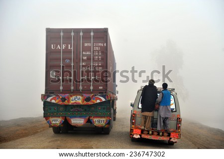 QUETTA, PAKISTAN - FEB 25: Trucks moving on a road in Pakistan on February 25, 2011 in Quetta,Pakistan