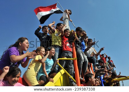 TURKISH-SYRIAN BORDER -JUNE 18, 2011: unidentified Syrian people are demonstrating against Beshar Al Assad on June 18, 2011 on the Turkish - Syrian border.