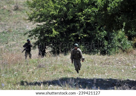 TURKISH-SYRIAN BORDER -JUNE 19, 2011: Unidentified Turkish soldier guard along the border, due to the war in Syria on June 19, 2011 on the Turkish - Syrian border.
