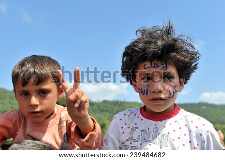 TURKISH-SYRIAN BORDER -JUNE 11, 2011: unidentified Syrian refugees, protested at the syria border   June 11, 2011 on the Turkish - Syrian border.