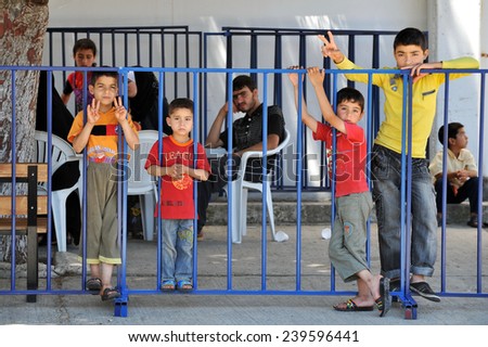TURKISH-SYRIAN BORDER -JUNE  27, 2011: Syrian  refugee camp in Turkey on June 27, 2011 on the Turkish - Syrian border.