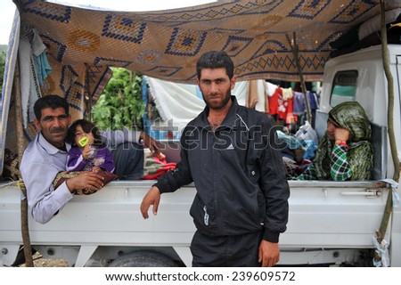 TURKISH-SYRIAN BORDER -JUNE 11, 2011: unidentified Syrian refugees,  at the syria border June 11, 2011 on the Turkish - Syrian border.