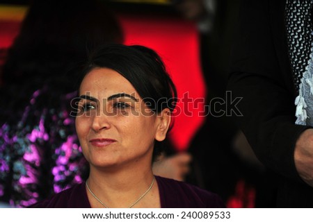 VAN,TURKEY - MARCH 20: Kurds celebrating their traditional feast Newroz that means \'new day\' in kurdish on March 20, 2010 in Van, Turkey.BDP deputy Aysel Tugluk, attended the ceremony.