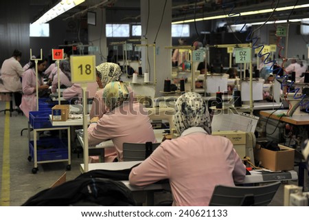 MUS, TURKEY - APRIL 24, 2011: Unidentified  women ironed shirts in clothing factory,l on April 24, 2011 Mus,Turkey