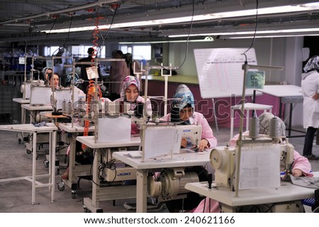 MUS, TURKEY - APRIL 24, 2011: Unidentified  women ironed shirts in clothing factory,l on April 24, 2011 Mus,Turkey