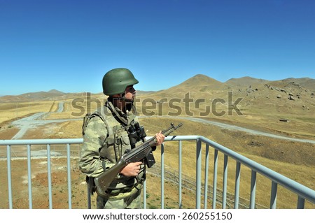 TURKISH-I RAN  BORDER - AUGUST 30, 2011: Unidentified Turkish soldier guard along the border on August 30, 2011