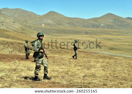 TURKISH-I RAN  BORDER - AUGUST 30, 2011: Unidentified Turkish soldier guard along the border on August 30, 2011